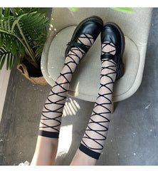 Solid cross front knee high socks