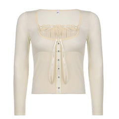 Solid long sleeve lace hem button self tie top