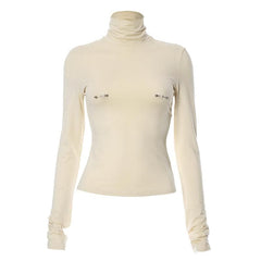 Metal applique turtle neck long sleeve solid top
