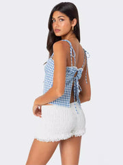 A Backless Checkered Halter Top With Straps