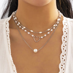 Collar de 3 piezas con corazón de perlas sintéticas 