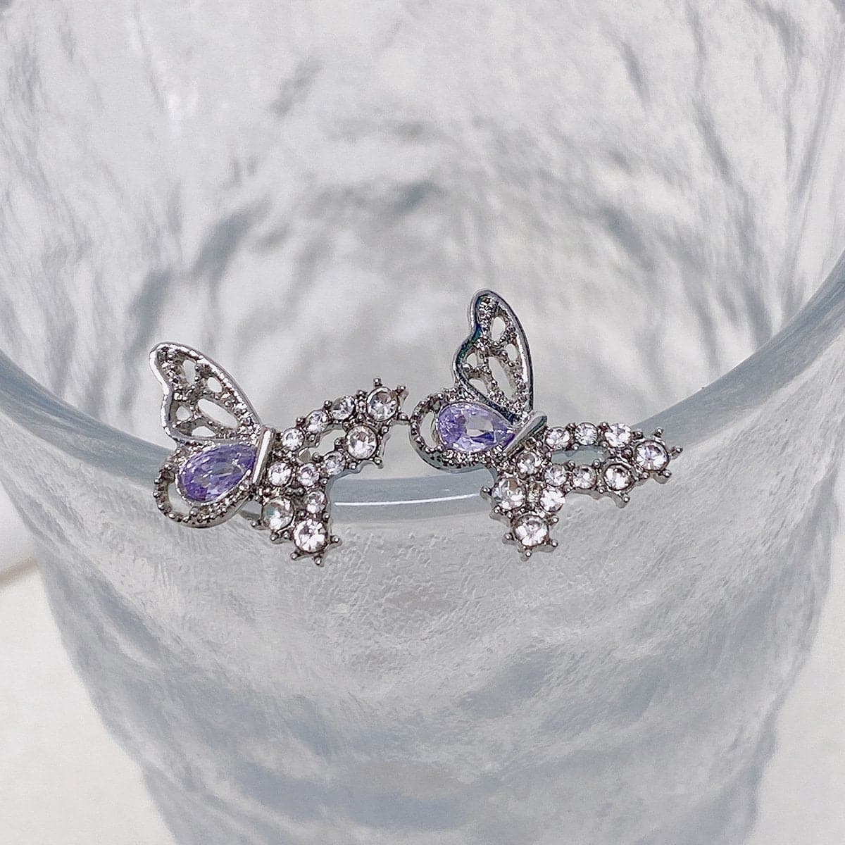 Pendientes de mariposa con colgante de piedra y diamantes de imitación 