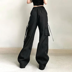 Pantalón ancho con bolsillo cargo sólido y cordón ajustable 