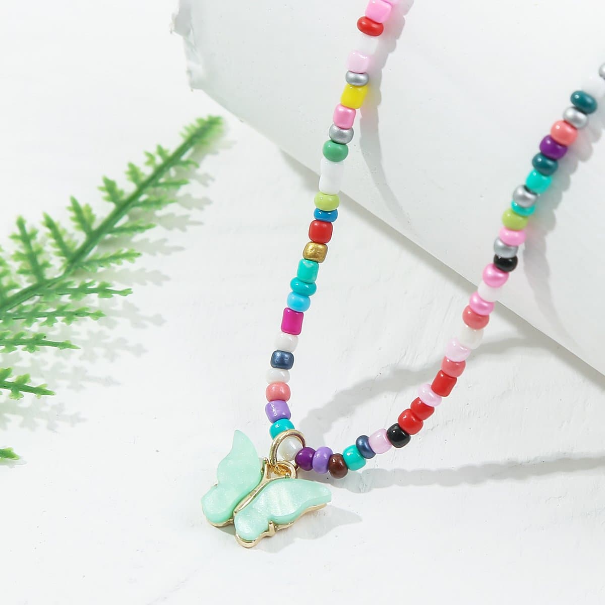 Multicolor clay beaded butterfly pendant necklace