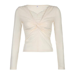 Knotted solid ruched long sleeve lace hem top