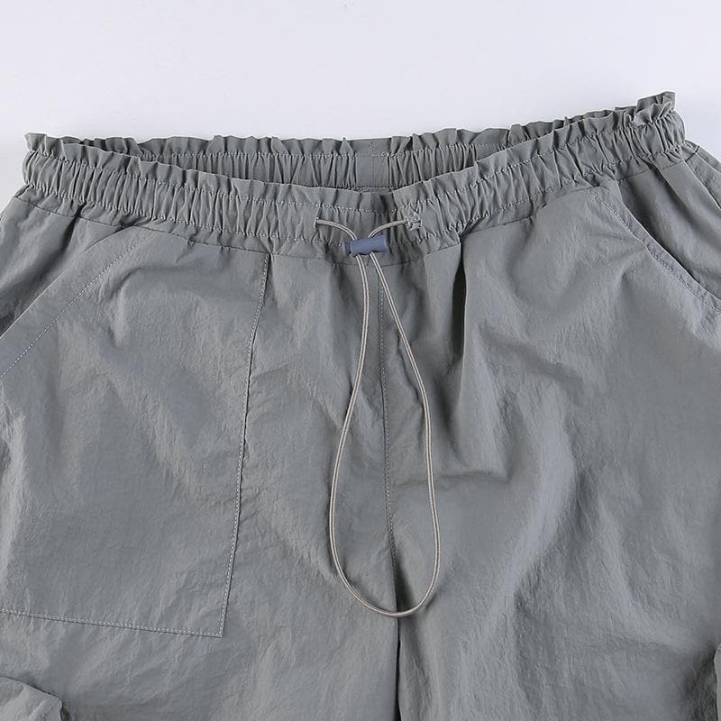 Pantalón holgado de tiro bajo con bolsillo cargo sólido y cordón ajustable 